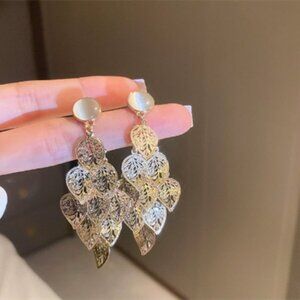 Silver needle geometric hollowed-out circular twisted pendant earrings